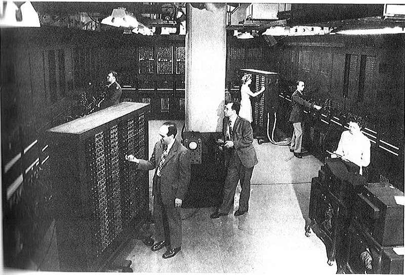 General view of ENIAC with Mauchly and Eckert